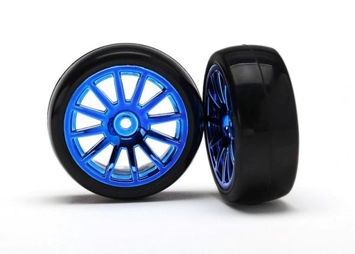 Traxxas 7573R - Tires & Wheels Assembled Glued (12-Spoke Blue Chrome Wheels slick tires) (2) (769282965553)